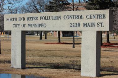 Large concrete sign with text reading North End Water Pollution Control Centre, City of Winnipeg, 2230 Main St.