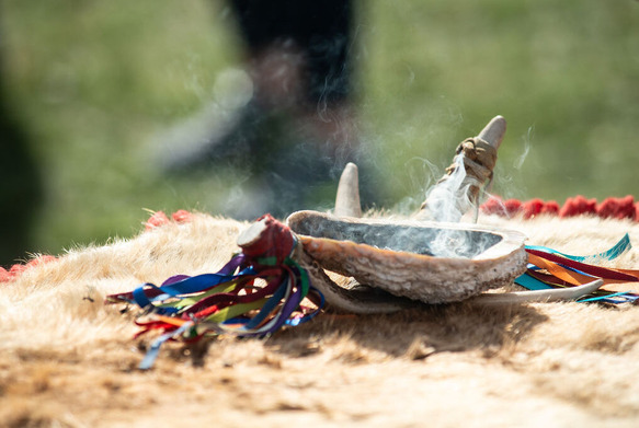 A smudge bowl with burning sage